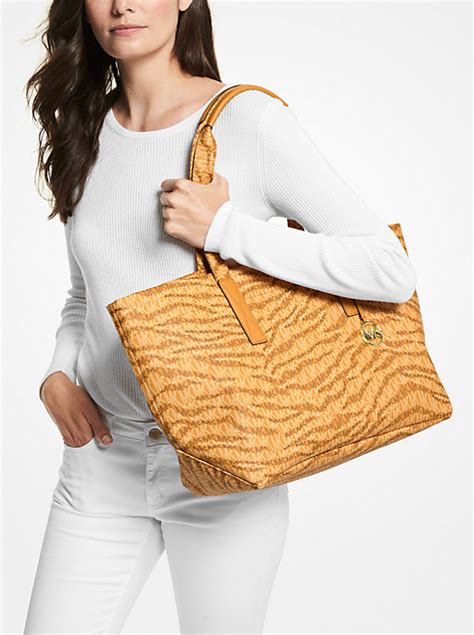 michael kors kinsley tote in animal print|The Michael Large Animal Print Logo Tote Bag.